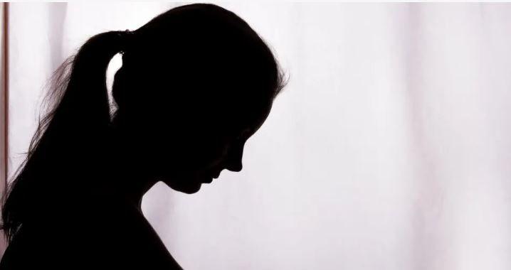 A shadow of a woman victim of domestic violence