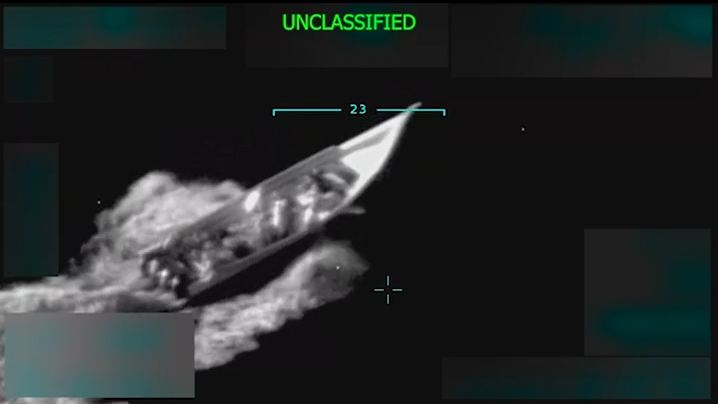 A screengrab from the video posted by Donald Trump allegedly sowing a "drug boat" sailing in the Caribbean. The footage is grainy, but clearly shows a boat with a number of people onboard.