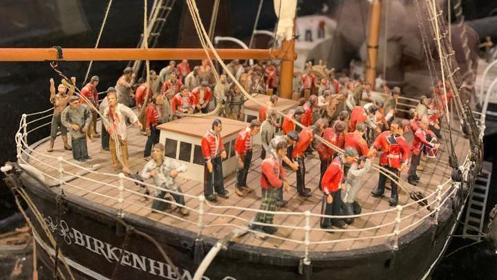 A model showing the sinking ship with soldiers standing on deck