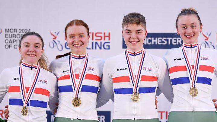 From left, Grace Lister, Kate Richardson, Izzy Sharp and Madelaine Leech with gold medals around their necks after winning the Women's Team Pursuit Finals at the British Cycling National Track Championships 2024