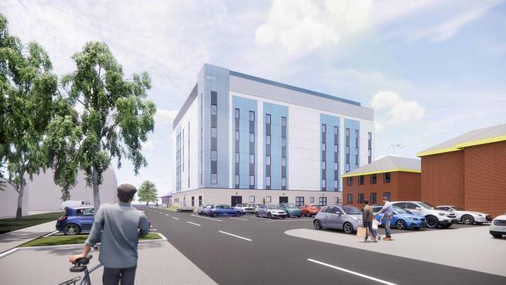 An artist's impression of the completed ward building viewed from the car park where pedestrians are walking