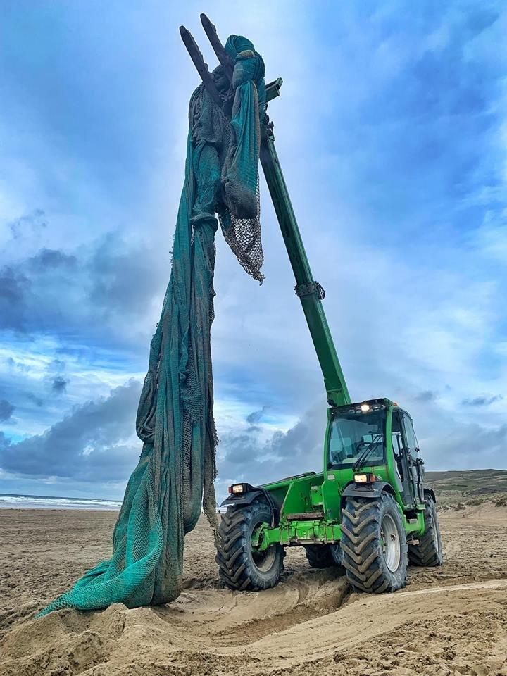 ghost net being lifted by tractor