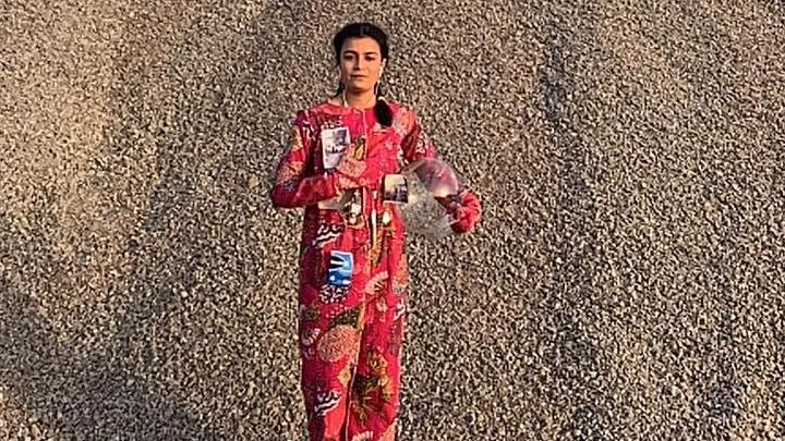 Anurita Chandola wearing a red jump suit