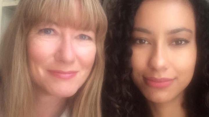 On the left, Ms Gibson with long blonde hair and a fringe, and her daughter, on the right, with sunglasses on the top of her head and dark brown hair