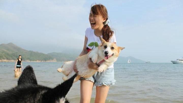 A laughing Kasumi with her dogs at Lamma Island, Hong Kong