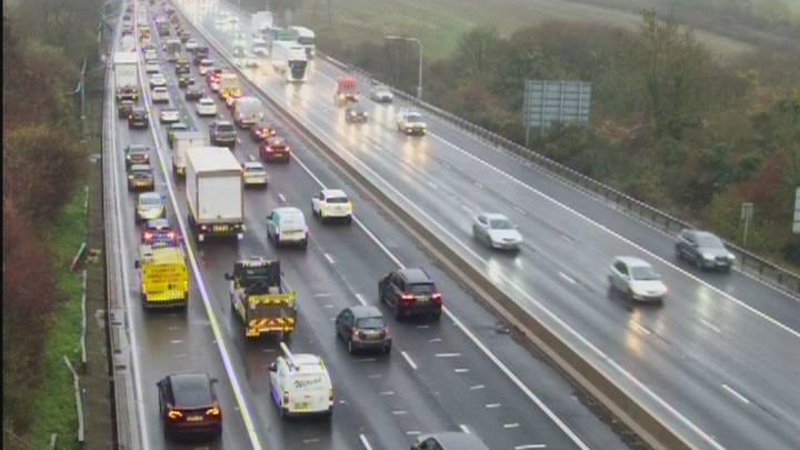 A view of the M1 where traffic seems to be stopped on the carriageway closest to the camera.