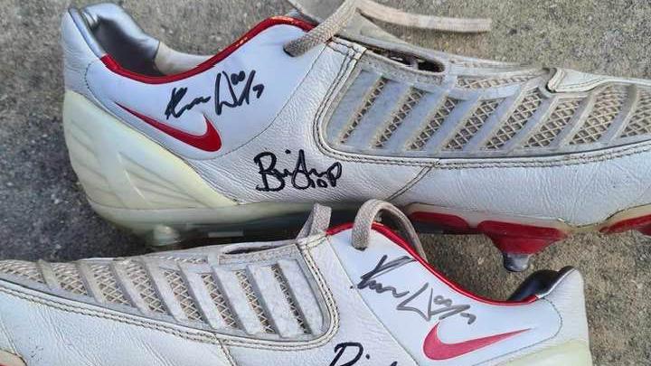 A pair of signed football boots