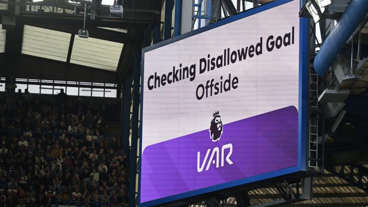 Scoreboard showing a VAR check for offside