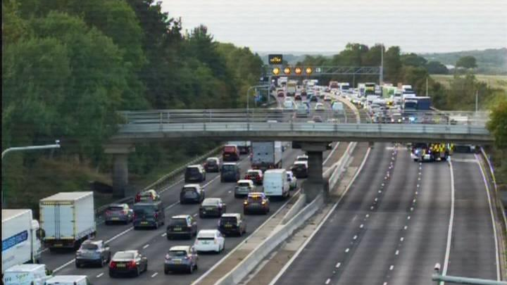 A different view of the lorry fire with traffic building on the opposite carriageway.