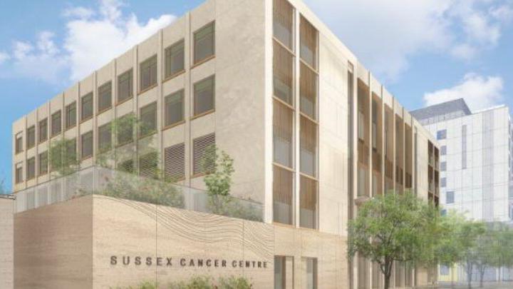 An artists impression of a new Sussex Cancer Centre showing a modern five storey building with landscaped trees outside and a first floor balcony with a garden