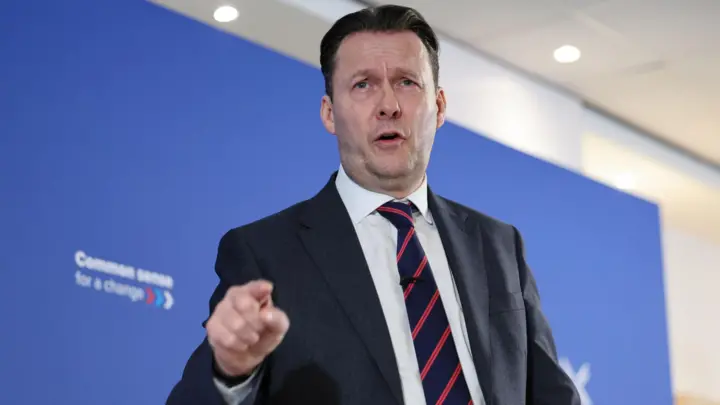 A polling station set up inside a community centre, ready for voters