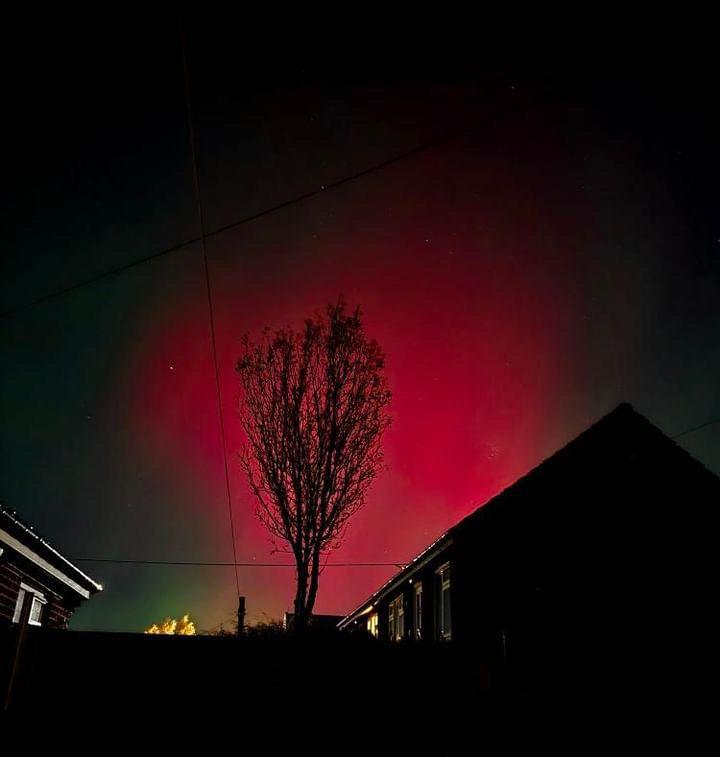 A deep red/pink hue seen alongside homes in Durham