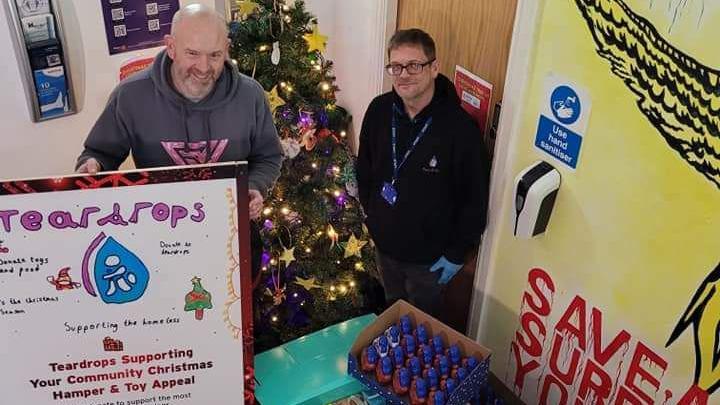 Nick Dyer (R) with supplies for local people in need