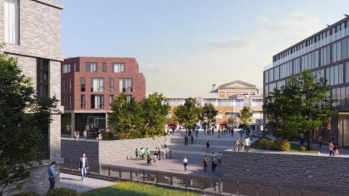 A computer-generated graphic showing how the Shrub Hill Quarter or Worcester may look once regeneration work is completed. There is a large open place with stepped area leading down to a body of water. There are modern-looking buildings and trees interspersed around a public open space.