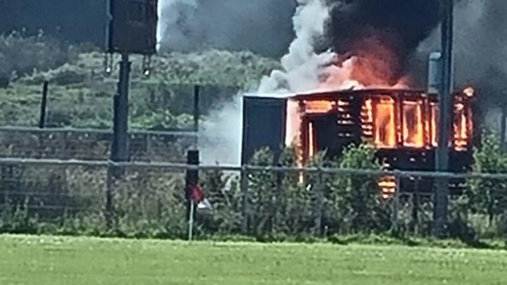A burning building from a distance.