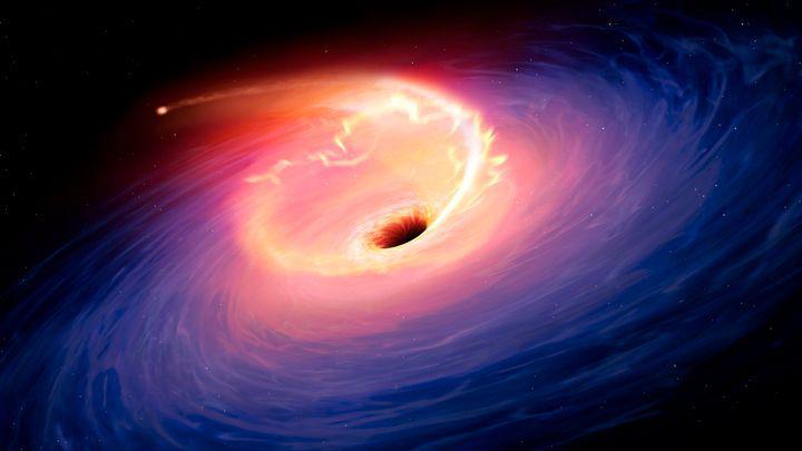 An illustration of a black hole shredding a star.