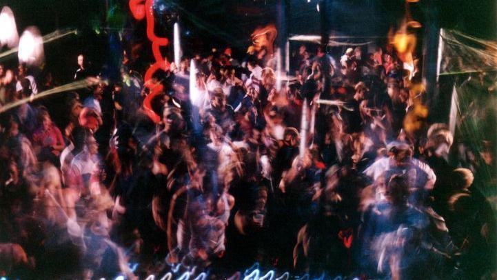 An abstract photo of a large group of people at a party