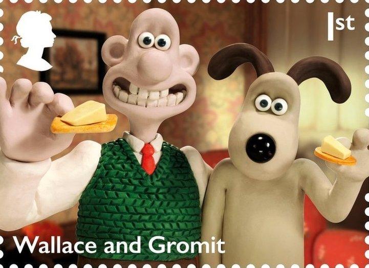 Wallace and Gromit animated characters holding crackers with a slice of cheese