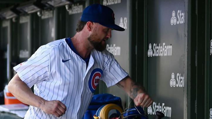 Chicago Cubs pitcher Colten Brewer punches a dugout wall in frustration after being replaced during a game against the Los Angeles Angels