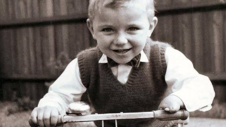 Steve on a scooter as a young boy