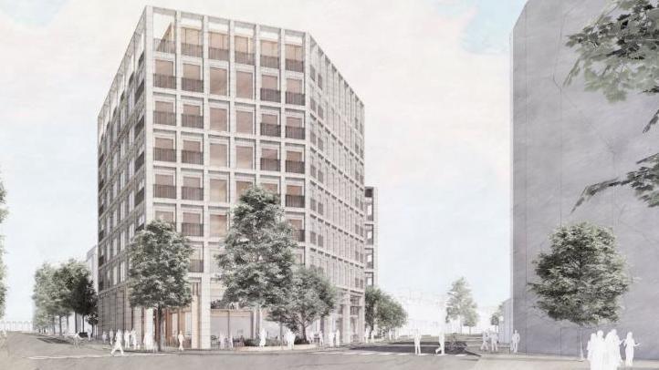 An artist's impression of an eight-storey modern office block with each elevation dominated by large windows. The design is a hexagon. There are trees around the outside. A circular building is also visible to the right.