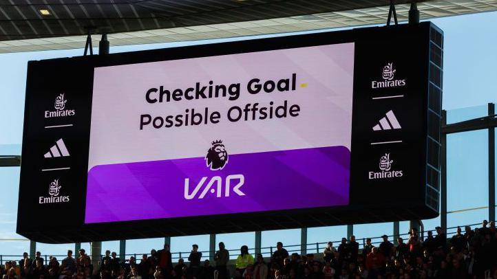 A VAR checking potential offside screen