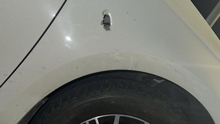 Hole in the side of car