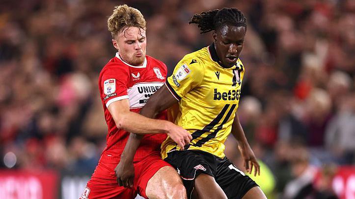 Middlesbrough's Tommy Conway and Stoke's Bosun Lawal battle for the ball