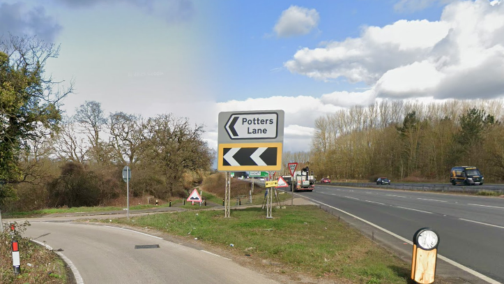 The junction of Potters Lane and the A3. A sign as pointing arrow says 'Potters Lane.' The A3 with cars can be seen in the background.