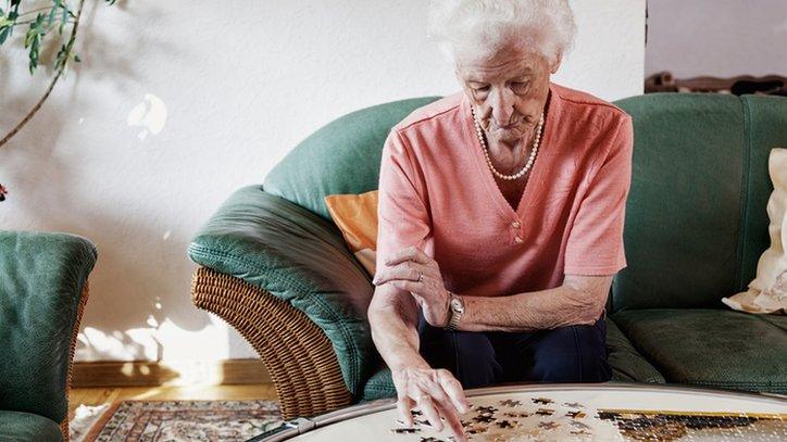 Woman doing jigsaw