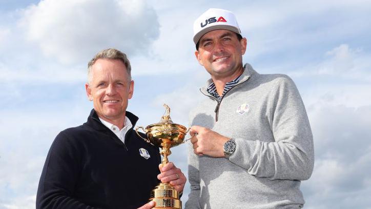 Team Captains Luke Donald of England and Keegan Bradley of The United States pose for a photograph with the Ryder Cup trophy.