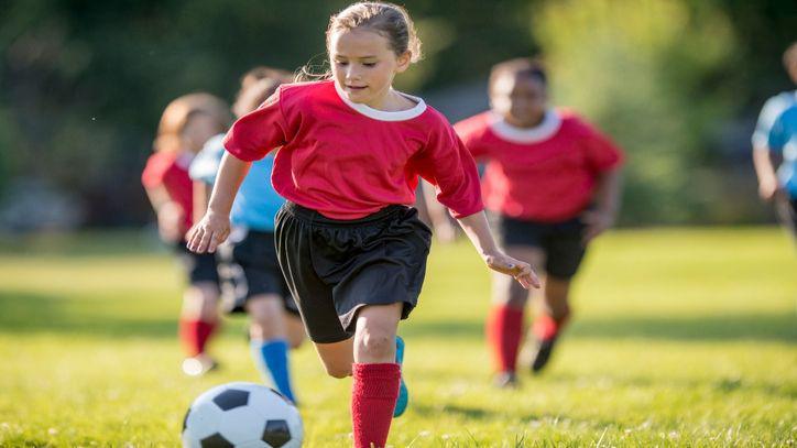 girl playing football