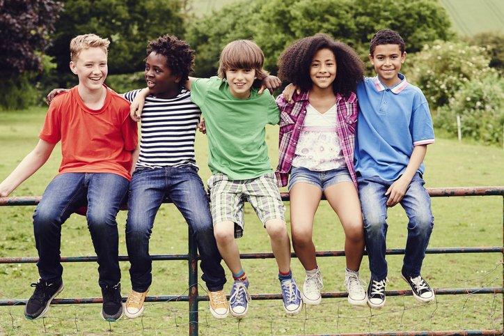 children on a fence