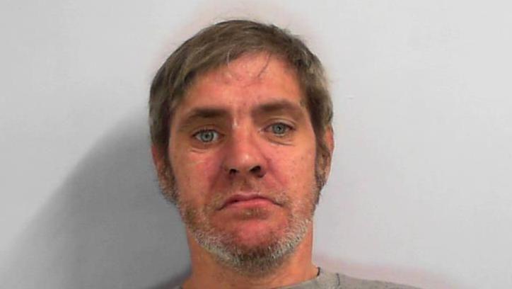 Custody picture of Vincent Morgan, a man with a short grey beard and short light hair
