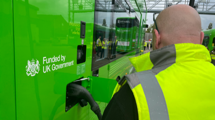 Electric bus being charged