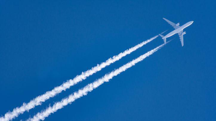 An airplane flying in the blue sky 