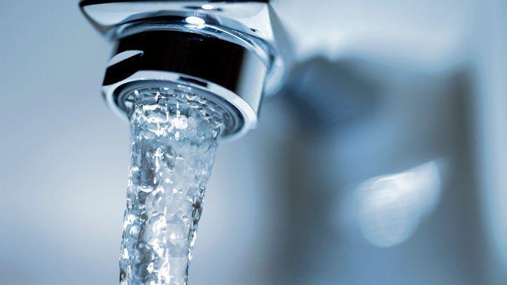 Running water from a tap.