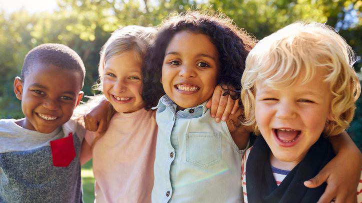 Four friends smiling.