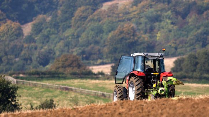 Tractor ploughing a field.