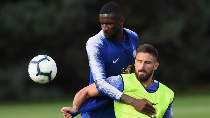 Antonio Rudiger (back) challenges Giroud during training at Chelsea in 2018