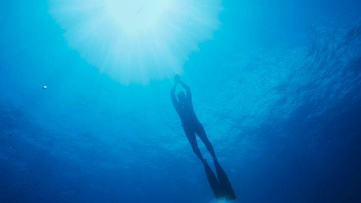 A freediver in the water.