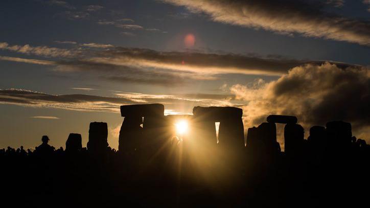 Sunset at Stonehenge on the night of the Summer solstice.