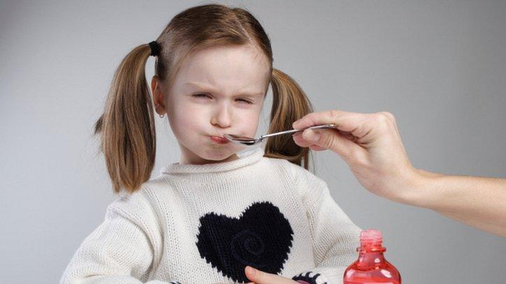 Girl taking medicine