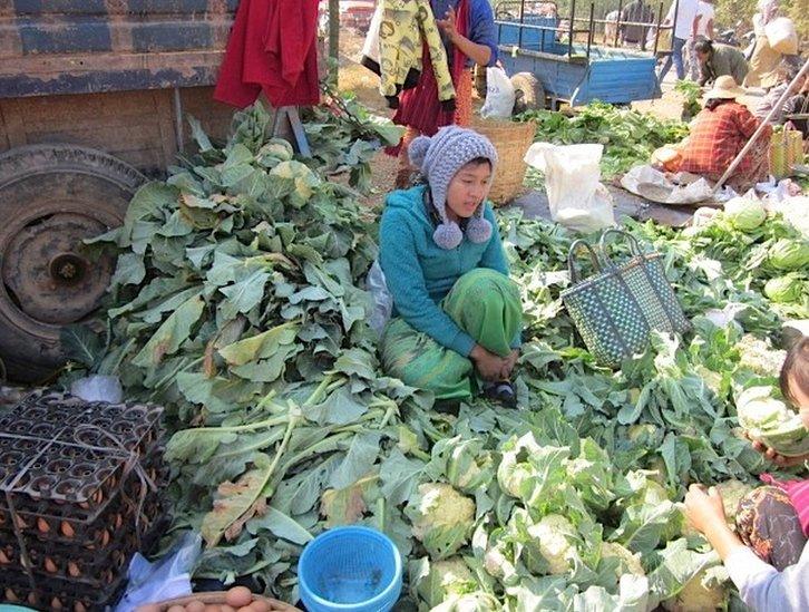 Woman selling food at a market