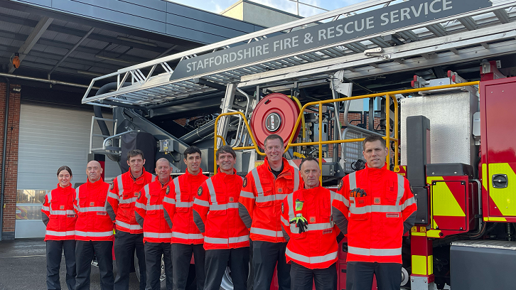 Firefighters in front of one of the engines