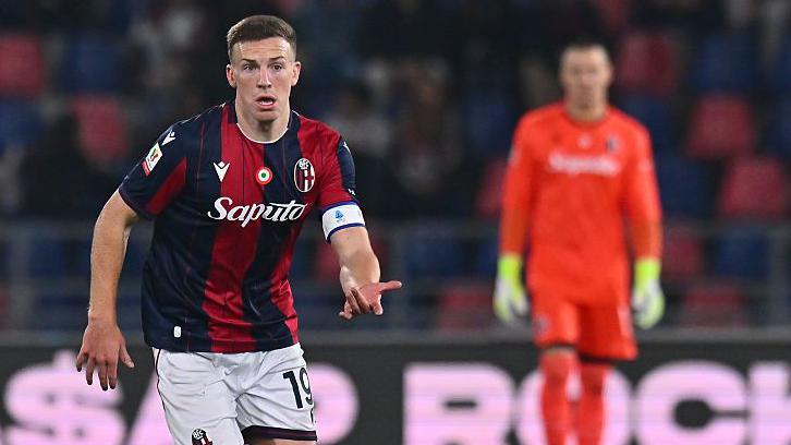Bologna captain Lewis Ferguson carries the ball in midfield during Bologna's Serie A match against Lazio
