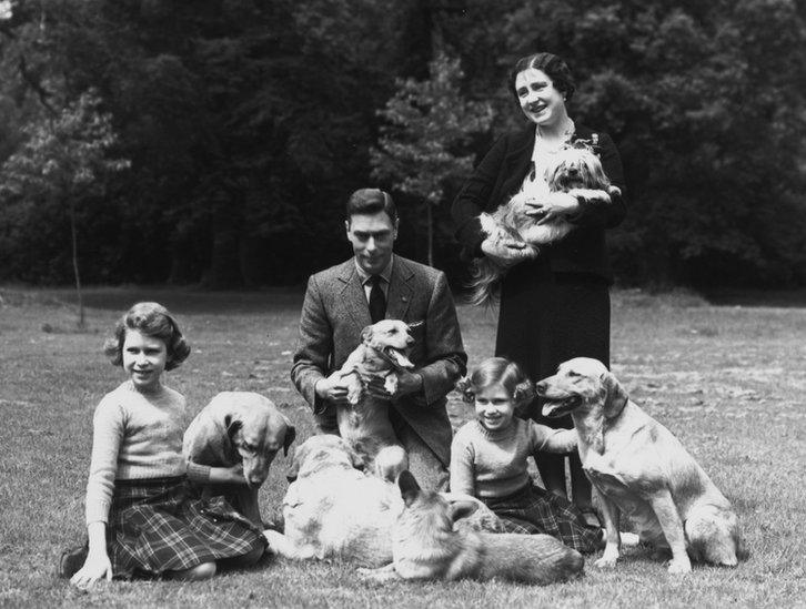 King George VI (1895 - 1952) and Queen Elizabeth with Princesses Margaret Rose (1930 - 2002) and Elizabeth (left) in the grounds of Windsor Castle, Berkshire, 1936