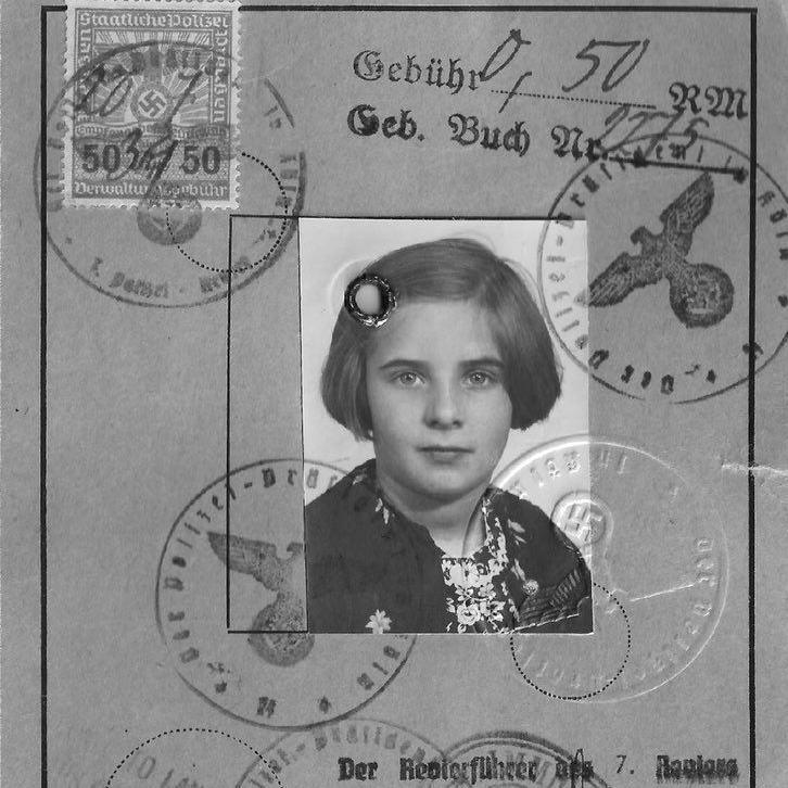 Hanna Zack's identity card, bearing a black and white photograph of a girl with bobbed hair. The card has several Nazi official stamps