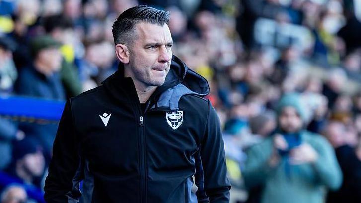 Matt Bloomfield watches on from the touchline against Bristol City