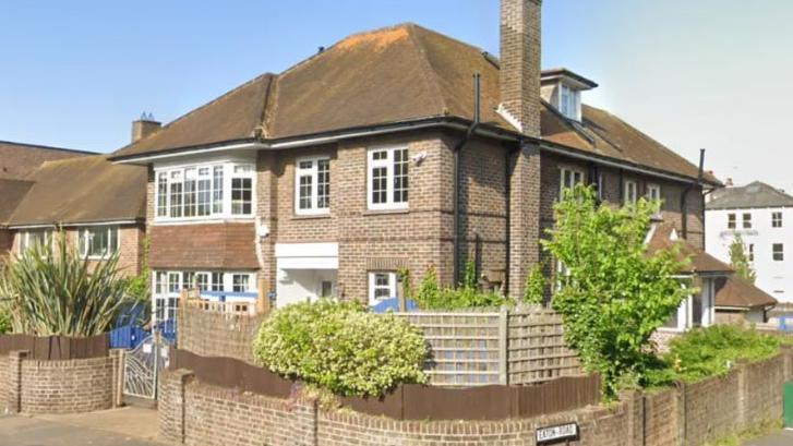 A google maps image of a large brick building ina  residential area which is used as the current base for the nursery